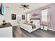 Main bedroom with king-size bed and en-suite bathroom at 3032 Mahalo Dr, Davenport, FL 33897