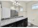 Bathroom with granite countertop and updated vanity at 3032 Mahalo Dr, Davenport, FL 33897