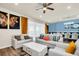Bright living room features stylish sofas, a coffee table, and decorative accents at 3032 Mahalo Dr, Davenport, FL 33897