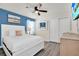 Bedroom with a white bed frame and ceiling fan at 3032 Mahalo Dr, Davenport, FL 33897