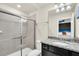 Bathroom with a walk-in shower and granite countertop vanity at 3032 Mahalo Dr, Davenport, FL 33897