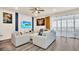 Bright living room featuring comfortable seating and hardwood floors at 3032 Mahalo Dr, Davenport, FL 33897
