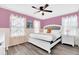 Spacious bedroom with a king-size bed and ceiling fan at 3032 Mahalo Dr, Davenport, FL 33897