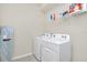 Clean laundry room featuring a washer and dryer at 3032 Mahalo Dr, Davenport, FL 33897