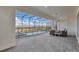 Spacious screened-in pool area with patio furniture and spa at 3032 Mahalo Dr, Davenport, FL 33897