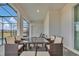 Relaxing patio with table, chairs, and view of the pool at 3032 Mahalo Dr, Davenport, FL 33897