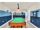 Game room with pool table and blue walls at 3032 Mahalo Dr, Davenport, FL 33897