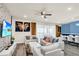 Spacious living room with comfortable seating and large sliding doors at 3032 Mahalo Dr, Davenport, FL 33897