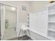 Bright laundry room with washer, dryer, and built-in storage at 3032 Mahalo Dr, Davenport, FL 33897