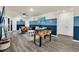 Game room with foosball table and blue walls at 3032 Mahalo Dr, Davenport, FL 33897