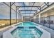 Relaxing screened pool and spa with patio area at 3032 Mahalo Dr, Davenport, FL 33897