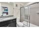 Bathroom with shower and granite countertop at 3032 Mahalo Dr, Davenport, FL 33897