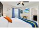 Main bedroom with a large bed and ensuite bathroom at 3032 Mahalo Dr, Davenport, FL 33897
