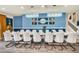 Spacious dining area, featuring a large table and statement wall art at 3032 Mahalo Dr, Davenport, FL 33897