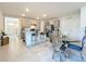 Open concept dining area with glass table and modern chairs at 30380 Armenia Rd, Leesburg, FL 34748