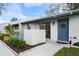 Condo exterior showcasing a private entrance and lush landscaping at 3163 Yorych Ln, Orlando, FL 32822