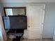 Bedroom with a large TV and built-in closet at 4803 Apple Blossom Ln # 4803, St Cloud, FL 34771