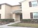 Two-story townhome with front door and landscaping at 4803 Apple Blossom Ln # 4803, St Cloud, FL 34771
