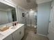 Modern bathroom with a double vanity and a walk-in shower at 4803 Apple Blossom Ln # 4803, Saint Cloud, FL 34771