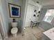 Bathroom with toilet, storage, and decorative wall art at 4803 Apple Blossom Ln # 4803, St Cloud, FL 34771