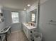 Bathroom with a double vanity and a large mirror at 4803 Apple Blossom Ln # 4803, St Cloud, FL 34771