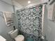 Bathroom with shower/tub combo, toilet and patterned shower curtain at 4803 Apple Blossom Ln # 4803, St Cloud, FL 34771