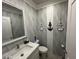 Stylish bathroom with unique wave patterned tile and nautical accents at 4803 Apple Blossom Ln # 4803, St Cloud, FL 34771