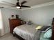 Bedroom with a double bed, dresser, and ceiling fan at 4803 Apple Blossom Ln # 4803, St Cloud, FL 34771