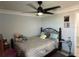 Bright bedroom with a double bed, dresser, and ceiling fan at 4803 Apple Blossom Ln # 4803, St Cloud, FL 34771