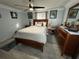 Spacious bedroom with a queen-size bed and wooden furniture at 4803 Apple Blossom Ln # 4803, St Cloud, FL 34771
