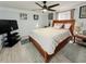 Cozy bedroom with a queen-size bed and wood frame at 4803 Apple Blossom Ln # 4803, Saint Cloud, FL 34771