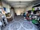 Garage with tiled floor, storage shelves, and a ladder at 4803 Apple Blossom Ln # 4803, St Cloud, FL 34771
