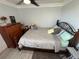 Bright bedroom with double bed, dresser, and ceiling fan at 4803 Apple Blossom Ln # 4803, St Cloud, FL 34771