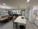 Open concept kitchen with island seating and views into the living and dining areas at 4803 Apple Blossom Ln # 4803, St Cloud, FL 34771