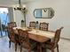 Bright dining room featuring a large wooden table and statement mirror at 4803 Apple Blossom Ln # 4803, St Cloud, FL 34771