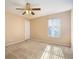 Bedroom with ceiling fan and neutral walls at 498 Freeman St, Longwood, FL 32750