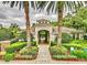 Community center with an archway entry and lush landscaping at 6214 Stevenson Dr # 303, Orlando, FL 32835