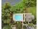 Aerial view of community pool with surrounding lush greenery at 6214 Stevenson Dr # 303, Orlando, FL 32835