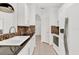 Bright kitchen with white cabinets, double sink, and mosaic backsplash at 6214 Stevenson Dr # 303, Orlando, FL 32835