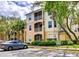 Condo building with ample parking and landscaping at 6214 Stevenson Dr # 303, Orlando, FL 32835