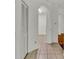 Clean hallway with tile floors and access to laundry and other rooms at 6214 Stevenson Dr # 303, Orlando, FL 32835