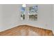 Well-lit bedroom featuring hardwood floors and a large window at 6214 Stevenson Dr # 303, Orlando, FL 32835