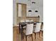 Modern dining room with dark wood table and seating for six at 6214 Stevenson Dr # 303, Orlando, FL 32835