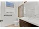 Clean bathroom with white vanity and a tiled accent wall at 6214 Stevenson Dr # 303, Orlando, FL 32835