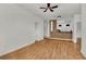 Open living room with hardwood floors and kitchen views at 6214 Stevenson Dr # 303, Orlando, FL 32835