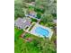 Community pool and clubhouse with plenty of lounge chairs at 6214 Stevenson Dr # 303, Orlando, FL 32835