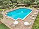 Community pool with plenty of lounge chairs for relaxing at 6214 Stevenson Dr # 303, Orlando, FL 32835