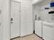 Convenient laundry room with washer, dryer, and extra storage at 6214 Stevenson Dr # 303, Orlando, FL 32835