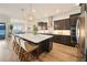 Modern kitchen with dark cabinets, quartz counters and island at 7645 Green Mountain Way, Winter Garden, FL 34787