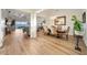 Elegant dining room with hardwood floors, a view into the living room and access to the kitchen at 7645 Green Mountain Way, Winter Garden, FL 34787